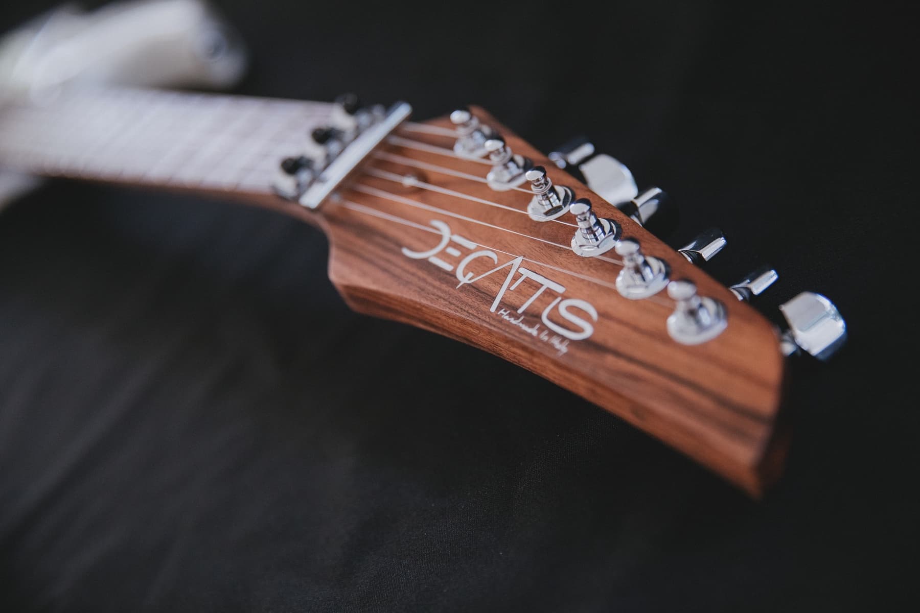 The Brazilian rosewood headstock with the marque