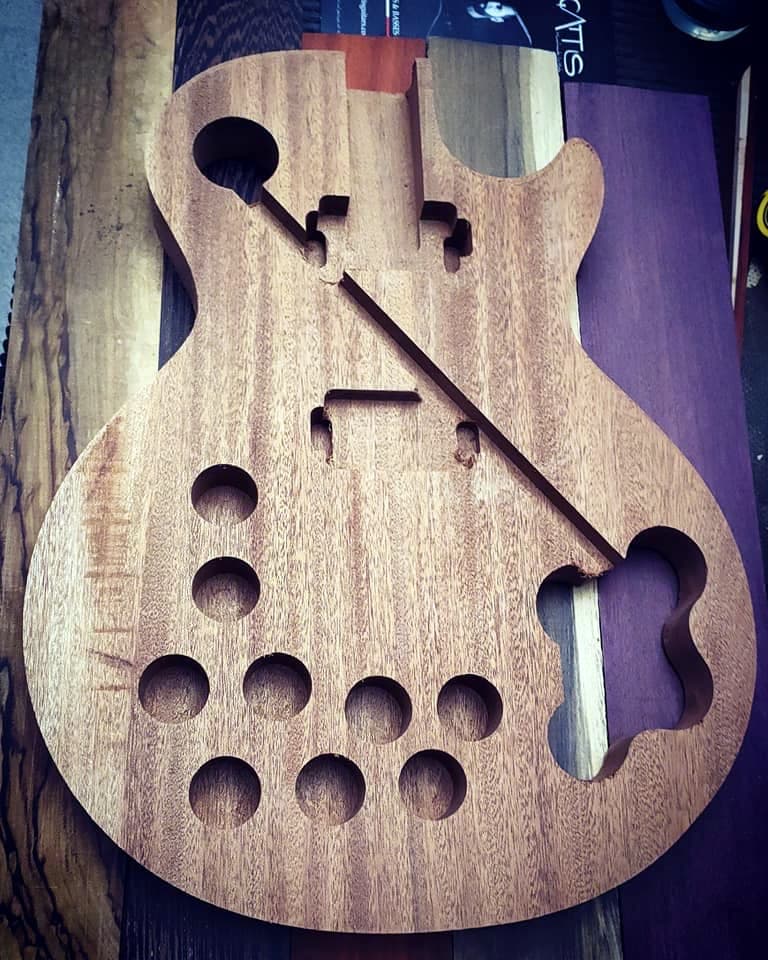 A mahogany body with the weight-relief chambers carved inside